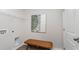 Functional laundry room featuring a woven bench, art and storage, blending practicality with simple design elements at 627 Culmen Ct., Myrtle Beach, SC 29588