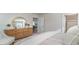 Spacious bedroom with an ensuite bathroom, dresser with mirror, and relaxing decor at 627 Culmen Ct., Myrtle Beach, SC 29588