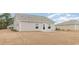 View of the home's back exterior and spacious backyard at 631 Culmen Ct., Myrtle Beach, SC 29588