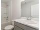 Bright bathroom with a large mirror, vanity, and shower-tub combo at 631 Culmen Ct., Myrtle Beach, SC 29588