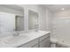 Bathroom with double vanity, white cabinets, and a walk-in shower at 631 Culmen Ct., Myrtle Beach, SC 29588