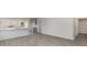 Spacious living area featuring stylish gray cabinets, wood-look floors, and an open layout to the kitchen at 631 Culmen Ct., Myrtle Beach, SC 29588