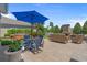 Landscaped backyard featuring an outdoor dining and seating area, and water views at 631 Edgecreek Dr., Myrtle Beach, SC 29579