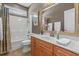 Bathroom features a vanity with a large framed mirror, marble countertops, and a shower-tub combo at 631 Edgecreek Dr., Myrtle Beach, SC 29579