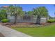 Community sign with lush landscaping, flowers, and palm trees at the entrance at 631 Edgecreek Dr., Myrtle Beach, SC 29579
