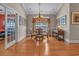 Elegant dining room with hardwood floors, a chandelier, and plenty of natural light at 631 Edgecreek Dr., Myrtle Beach, SC 29579