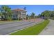 Community entrance with a guard house, attractive landscaping, and brick-paved road with signage at 631 Edgecreek Dr., Myrtle Beach, SC 29579