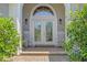 Inviting front entrance features rocking chairs, beautiful double doors, and a covered porch at 631 Edgecreek Dr., Myrtle Beach, SC 29579
