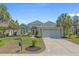 Charming single story home boasts a well manicured lawn, paved driveway and large garage at 631 Edgecreek Dr., Myrtle Beach, SC 29579