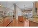 Bright eat-in kitchen with wood cabinets, granite countertops, stainless appliances, and hardwood floors at 631 Edgecreek Dr., Myrtle Beach, SC 29579