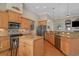 Bright kitchen with granite counters, stainless appliances, wood cabinets, and center island at 631 Edgecreek Dr., Myrtle Beach, SC 29579