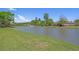 Scenic view of a pond with a fountain, surrounded by well-maintained lawns and mature trees in a residential area at 631 Edgecreek Dr., Myrtle Beach, SC 29579