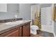Neutral bathroom featuring a vanity, toilet, and shower with curtain in a well-lit space at 6357 Highway 707, Myrtle Beach, SC 29588