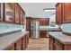 Spacious kitchen with stainless steel appliances, wood cabinets, and durable countertops at 6357 Highway 707, Myrtle Beach, SC 29588