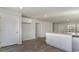 Open kitchen design with white cabinets and stainless steel appliances, adjoining the living area at 647 Culmen Ct., Myrtle Beach, SC 29588