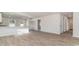 Spacious living space featuring modern wood-look floors and seamless flow to the kitchen at 647 Culmen Ct., Myrtle Beach, SC 29588