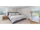 Comfortable bedroom with a plush bed, neutral tones, and ample natural light at 655 Culmen Ct., Myrtle Beach, SC 29588