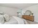 Bright bedroom with neutral colors, dresser with a mirror, and a comfortable seating area at 655 Culmen Ct., Myrtle Beach, SC 29588