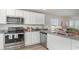 Modern kitchen with stainless steel appliances, granite countertops, and ample cabinet space at 655 Culmen Ct., Myrtle Beach, SC 29588