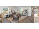 Bright and airy living room with neutral tones, wood-look floors, and stylish furnishings at 655 Culmen Ct., Myrtle Beach, SC 29588