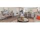 Open-concept living area with a kitchen view, stylish decor, and wood-look flooring at 655 Culmen Ct., Myrtle Beach, SC 29588
