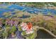 Stunning aerial view of a multi-unit home nestled near marshland and waterways offering scenic views and a serene environment at 66 Lakeview Circle # 106, Pawleys Island, SC 29585