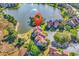 Aerial view of the community showcasing the well-maintained landscaping and lake with water feature at 66 Lakeview Circle # 106, Pawleys Island, SC 29585