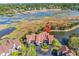An aerial shot highlights the property's proximity to water and lush surroundings, offering a blend of nature and residential living at 66 Lakeview Circle # 106, Pawleys Island, SC 29585