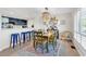 Dining area with an open layout, a unique chandelier, and seamless transition to the kitchen at 66 Lakeview Circle # 106, Pawleys Island, SC 29585