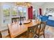 Bright dining area with ample natural light, a seamless flow to the living room, and views to the exterior at 66 Lakeview Circle # 106, Pawleys Island, SC 29585