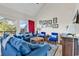 Spacious living room with comfortable seating, stylish decor, and access to an outdoor deck at 66 Lakeview Circle # 106, Pawleys Island, SC 29585