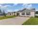 A row of single-story homes with well-maintained lawns and long concrete driveways at 663 Culmen Ct., Myrtle Beach, SC 29588