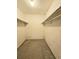 Walk-in closet with carpet floors and shelves, ready for customization and organization at 6638 Greenslake Point, Myrtle Beach, SC 29588