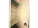 Standard closet with shelving and door, ideal for organizing storage at 6638 Greenslake Point, Myrtle Beach, SC 29588