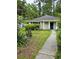 Cozy single-story home with a simple, tidy front yard and a walkway to the front door at 6638 Greenslake Point, Myrtle Beach, SC 29588