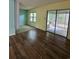 Open-concept living space with laminate flooring, access to a screened porch, and natural light at 6638 Greenslake Point, Myrtle Beach, SC 29588