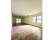 Large living room with wood flooring and a sliding glass door leading to the outside at 6638 Greenslake Point, Myrtle Beach, SC 29588