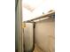 Water heater in a small closet space with wire shelf for storage at 6638 Greenslake Point, Myrtle Beach, SC 29588