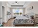 Bright bedroom featuring a ceiling fan, and a large window offering abundant natural light at 684 Wailea Circle, Little River, SC 29566