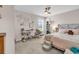Bright bedroom featuring a ceiling fan, workspace, and a cozy, inviting bed with a teddy bear at 684 Wailea Circle, Little River, SC 29566
