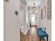Elegant entryway with a barn door, chandelier lighting, and stylish bench seating near the front door at 684 Wailea Circle, Little River, SC 29566