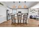 Modern kitchen featuring white cabinets, stainless steel appliances, and a stylish island with bar stool seating at 684 Wailea Circle, Little River, SC 29566