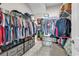 Spacious walk-in closet with shelves, hanging rods, dresser, and patterned floors at 684 Wailea Circle, Little River, SC 29566