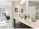 Stylish bathroom featuring a double vanity with white countertops and dark wood cabinets at 7075 Denim Loop, Myrtle Beach, SC 29579