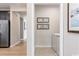 Convenient laundry room with modern appliances, neutral tones, and decorative wall art at 7075 Denim Loop, Myrtle Beach, SC 29579