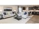 Open-concept living area featuring a kitchen with an island, dining area, and a comfortable seating area at 7075 Denim Loop, Myrtle Beach, SC 29579