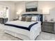Comfortable main bedroom with a large bed, stylish furniture, and plenty of natural light at 7075 Denim Loop, Myrtle Beach, SC 29579