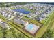 Aerial view of a residential neighborhood with community pool, clubhouse, and surrounding lake and trees at 732 Mustang Ranch Dr., Myrtle Beach, SC 29588