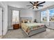 Cozy bedroom with a ceiling fan, two windows, and a queen sized bed at 732 Mustang Ranch Dr., Myrtle Beach, SC 29588