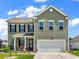 Charming two-story home with a well-manicured lawn and inviting front porch at 732 Mustang Ranch Dr., Myrtle Beach, SC 29588